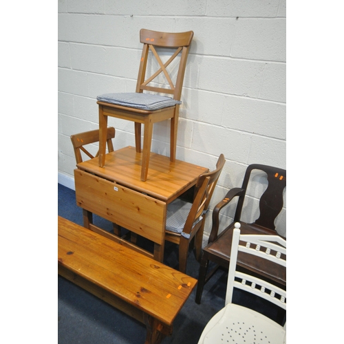 1277 - A MODERN PINE DROP LEAF TABLE, with three pine chairs, a pine bench, along with seven various chairs... 