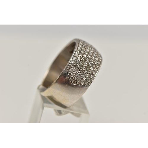 10 - A DIAMOND SET WIDE BAND RING, set with seven rows of brilliant cut diamonds to the front half band, ... 