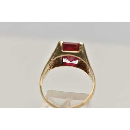 11 - A SYNTHETIC RUBY AND DIAMOND DRESS RING, designed as a central rectangular synthetic ruby in a four ... 