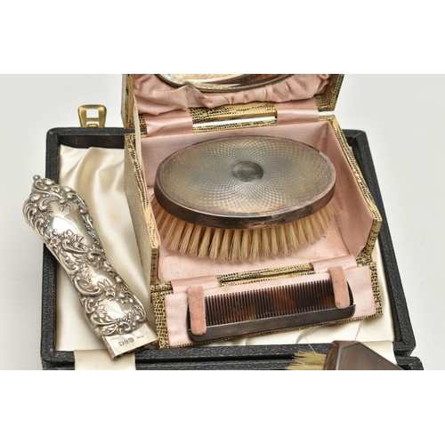 162 - TWO MID 20TH CENTURY CASED SILVER MOUNTED BRUSH AND COMB SETS, comprising a case containing a pair o... 