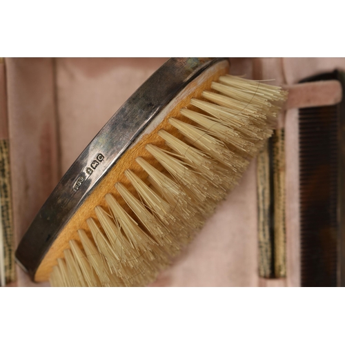 162 - TWO MID 20TH CENTURY CASED SILVER MOUNTED BRUSH AND COMB SETS, comprising a case containing a pair o... 