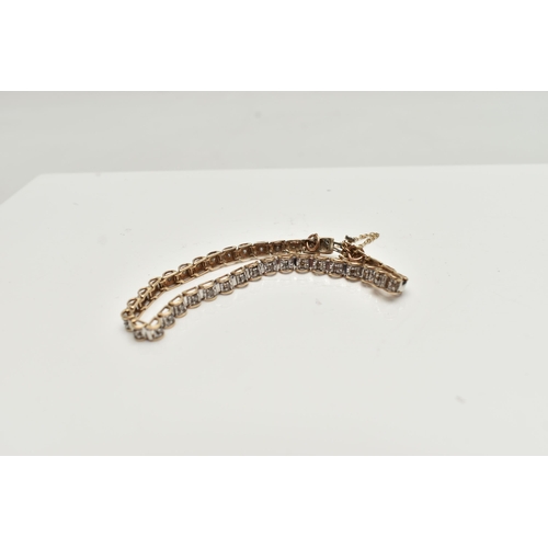 52 - A 9CT GOLD DIAMOND LINE BRACELET, designed as a series of box links each set with a small round bril... 