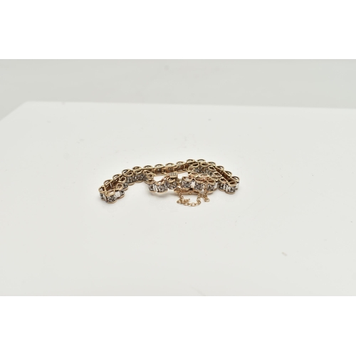 52 - A 9CT GOLD DIAMOND LINE BRACELET, designed as a series of box links each set with a small round bril... 