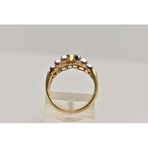 6 - A YELLOW DIAMOND RING, designed as a round brilliant yellow diamond within a collet setting to the t... 