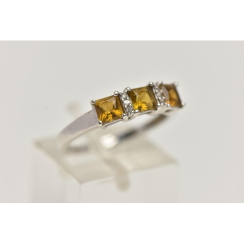 63 - A 9CT WHITE GOLD GEM SET RING, designed with three claw set, square cut citrines, interspaced with c... 