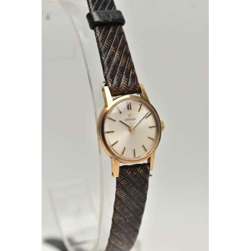 75 - A LADYS 9CT GOLD 'OMEGA' WRISTWATCH, manual wind, round silvered dial signed 'Omega', baton markers,... 