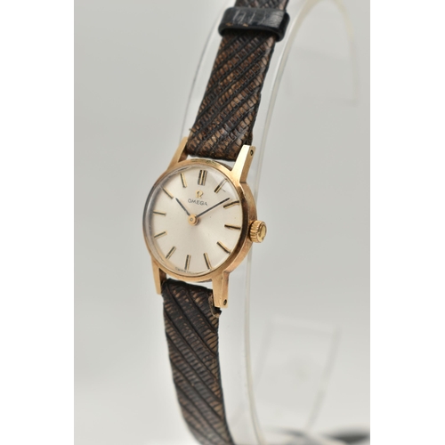 75 - A LADYS 9CT GOLD 'OMEGA' WRISTWATCH, manual wind, round silvered dial signed 'Omega', baton markers,... 