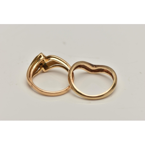 9 - TWO RINGS, the first a V-shape band, ring size M, the second a bifurcated design set with four small... 