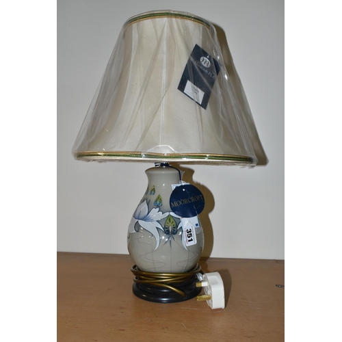 351 - A MODERN MOORCROFT POTTERY TABLE LAMP WITH SHADE, the lamp decorated with waterlily style flowers on... 