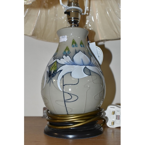 351 - A MODERN MOORCROFT POTTERY TABLE LAMP WITH SHADE, the lamp decorated with waterlily style flowers on... 