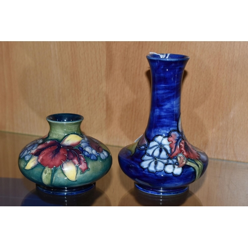 356 - TWO MOORCROFT POTTERY VASES DECORATED IN THE ORCHID AND SPRING FLOWERS PATTERN, comprising squat gre... 