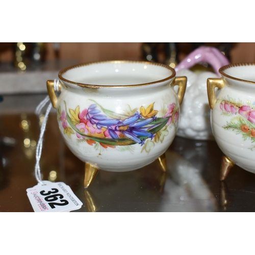 362 - TWO LATE 19TH CENTURY ROYAL WORCESTER CAULDRONS AND A BELLEEK STYLE PORCELAIN SHELL BASKET, the two ... 