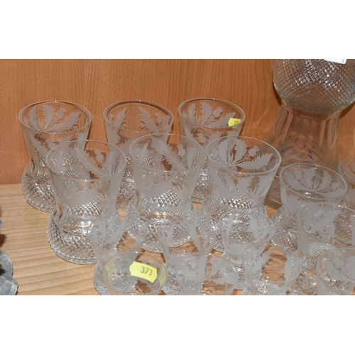 373 - A SUITE OF TWENTY FOUR EDINBURGH CRYSTAL THISTLE PATTERN DRINKING GLASSES AND MATCHING DECANTER, the... 