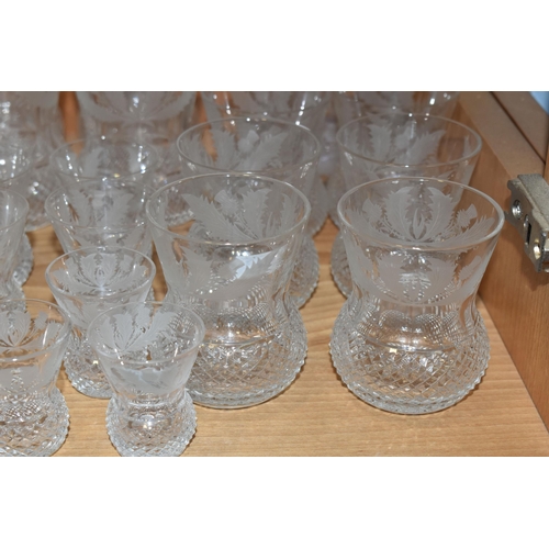 373 - A SUITE OF TWENTY FOUR EDINBURGH CRYSTAL THISTLE PATTERN DRINKING GLASSES AND MATCHING DECANTER, the... 