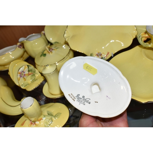 399 - A LARGE QUANTITY OF ROYAL WINTON YELLOW  'PETUNIA' PATTERN TABLEWARE, comprising a square cake plate... 