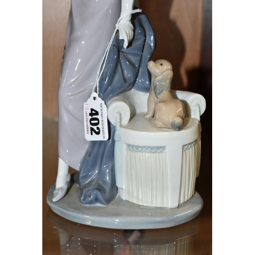 402 - A BOXED LLADRO FIGURE, 5174 an art deco style figure of a woman titled Dama Cuplé, height 34cm (1 + ... 