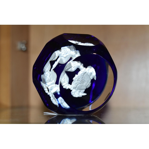 427 - A  FRENCH BACCARAT ZODIAC FACETED GLASS PAPERWEIGHT, with a cobalt blue base and central  white 'Can... 