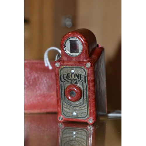 429 - A RED BAKELITE CORONET MIDGET  POCKET CAMERA, made by the Coronet Camera Co. Birmingham, with origin... 