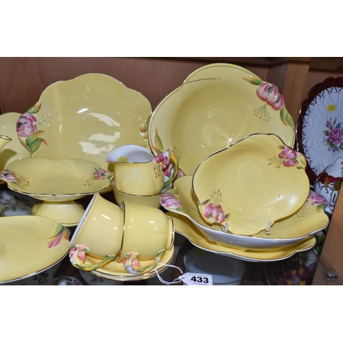 433 - A QUANTITY OF ROYAL WINTON  YELLOW 'PETUNIA' DESIGN TEA WARE, comprising two tennis sets (one cup so... 