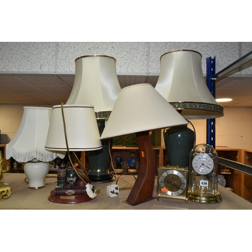 436 - A GROUP OF LAMPS AND CLOCKS, to include a pair of green ceramic table lamps with cream shades, heigh... 