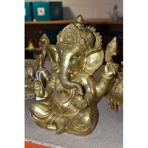 437 - THREE GILT METAL FIGURES OF GANESHA, one seated, and two reclining, height of tallest 22cm (3) (Cond... 