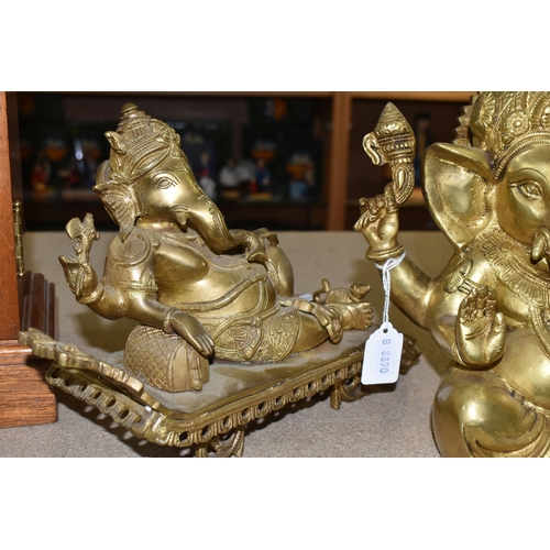 437 - THREE GILT METAL FIGURES OF GANESHA, one seated, and two reclining, height of tallest 22cm (3) (Cond... 