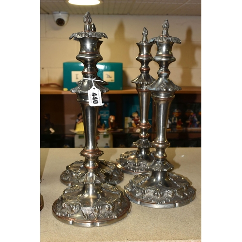 440 - FOUR SILVER PLATED CANDLESTICKS, two pairs of plated copper candlesticks with extinguishers, weighte... 