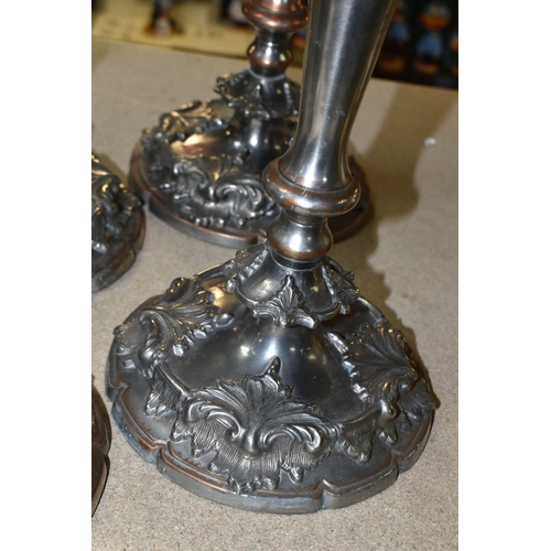 440 - FOUR SILVER PLATED CANDLESTICKS, two pairs of plated copper candlesticks with extinguishers, weighte... 