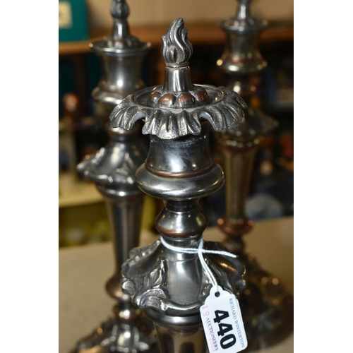 440 - FOUR SILVER PLATED CANDLESTICKS, two pairs of plated copper candlesticks with extinguishers, weighte... 