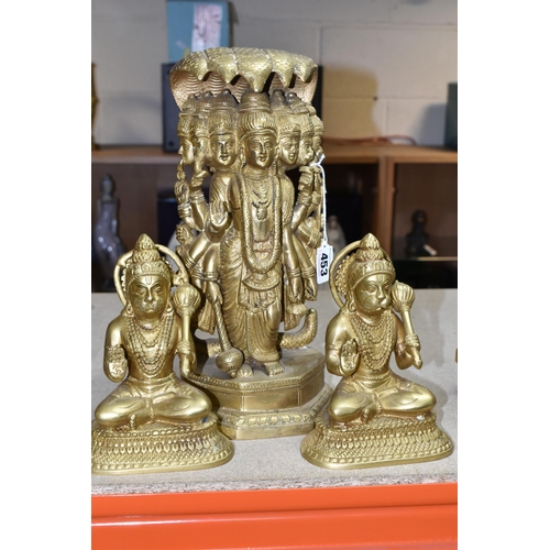 453 - THREE GILT METAL RELIGIOUS HINDU FIGURES, comprising two Lord Hanuman figures, height 17cm, together... 