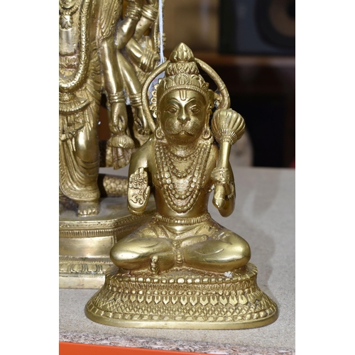 453 - THREE GILT METAL RELIGIOUS HINDU FIGURES, comprising two Lord Hanuman figures, height 17cm, together... 