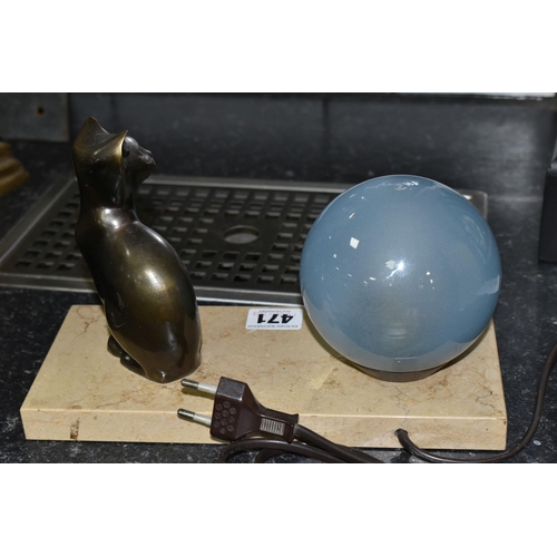 471 - A FRENCH ART DECO TABLE LAMP, featuring a seated cat figure and a blue glass globe shade on a stone ... 