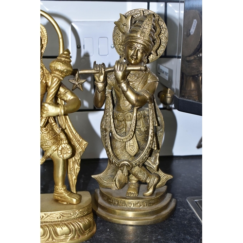 474 - THREE GILT METAL RELIGIOUS HINDU FIGURES, comprising Lord Hanuman, height 30cm, and two figures of L... 