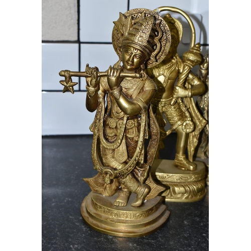 474 - THREE GILT METAL RELIGIOUS HINDU FIGURES, comprising Lord Hanuman, height 30cm, and two figures of L... 