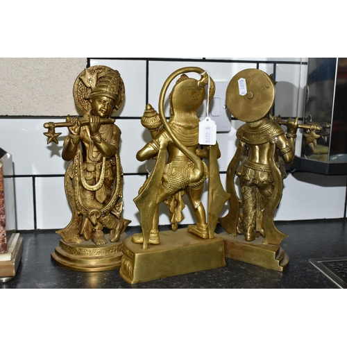 474 - THREE GILT METAL RELIGIOUS HINDU FIGURES, comprising Lord Hanuman, height 30cm, and two figures of L... 