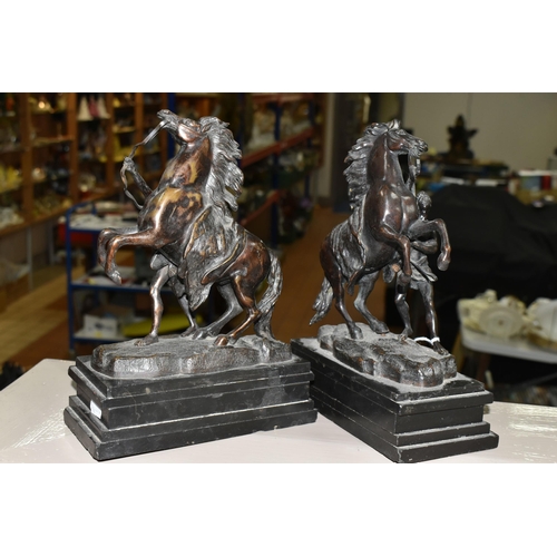 475 - A PAIR OF SPELTER 'MARLEY HORSES' FIGURES, on black slate plinths (2) (Condition report: one figure ... 