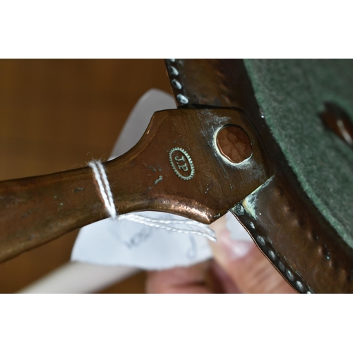 476 - A NEWLYN SCHOOL HAND HAMMERED COPPER CIRCULAR CHAMBERSTICK, stamped on the handle J.P (John Pearson ... 