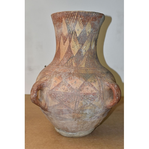 516 - A PAINTED TERRACOTTA FOUR HANDLED URN, POSSIBLY CHINESE OF NEOLITHIC STYLE, decorated with geometric... 