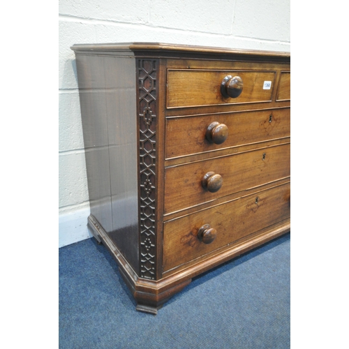 1195 - A GEORGIAN WALNUT CHEST OF TWO SHORT OVER THREE LONG GRADUATED DRAWERS, the canted front corners wit... 