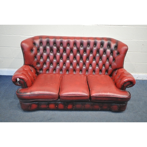 1198 - AN OXBLOOD LEATHER CHESTERFIELD SOFA, length 180cm (condition report:- no tears, crazing to cushions... 