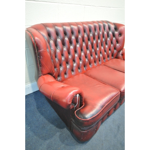 1198 - AN OXBLOOD LEATHER CHESTERFIELD SOFA, length 180cm (condition report:- no tears, crazing to cushions... 