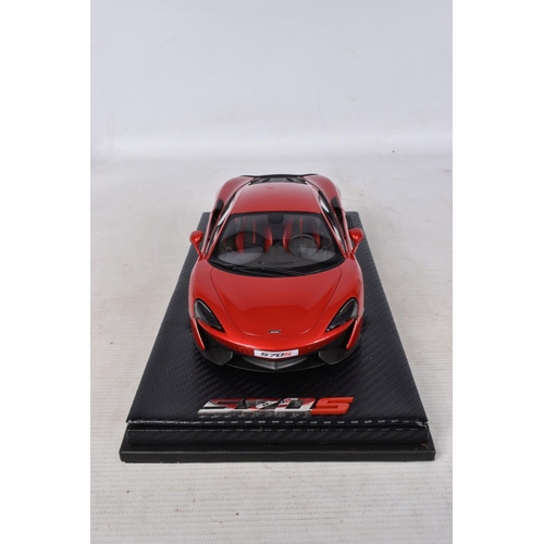 40 - A BOXED TECNOMODEL EXCLUSIVE COLLECTION MCLAREN 570S 1:18 MODEL VEHICLE, numbered T18-EX02C, in Verm... 