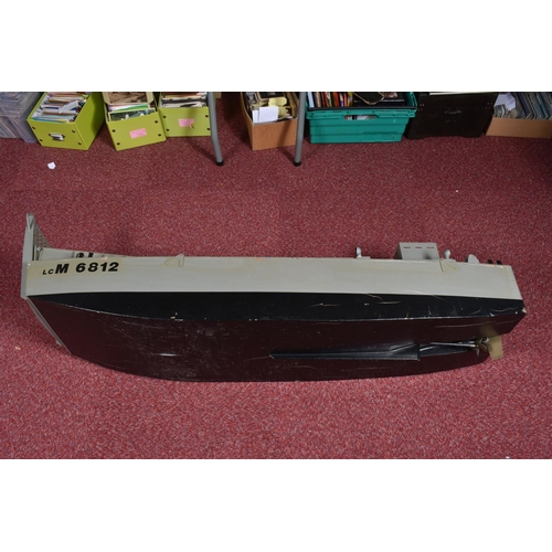 86 - A MOTORISED WOODEN KIT BUILT MILITARY LANDING CRAFT MODEL, told by client has been out on water, woo... 