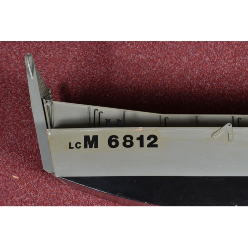 86 - A MOTORISED WOODEN KIT BUILT MILITARY LANDING CRAFT MODEL, told by client has been out on water, woo... 