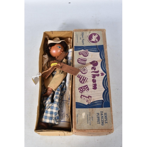 94 - FOUR BOXED PELHAM SS COWBOY PUPPETS, all in different outfits, with a boxed Pelham SS Cowgirl puppet... 