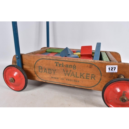 127 - A TRI-ANG BABY WALKER, wooden construction with red painted wheels and black tyres, blue handle with... 