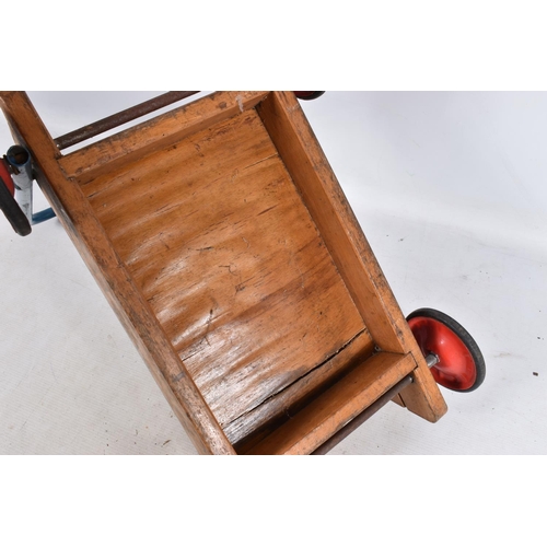 127 - A TRI-ANG BABY WALKER, wooden construction with red painted wheels and black tyres, blue handle with... 