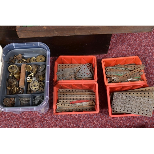 128 - A WOODEN BOX AND ONE OTHER CONTAINING VINTAGE MECCANO PIECES, to include pieces in green, red, yello... 