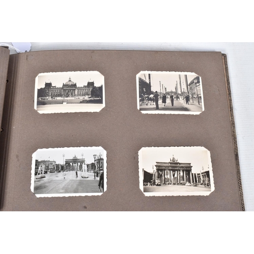 205 - A 1936 BERLIN OLYMPICS PHOTO ALBUM, this features 48 photos of various topics including street scene... 