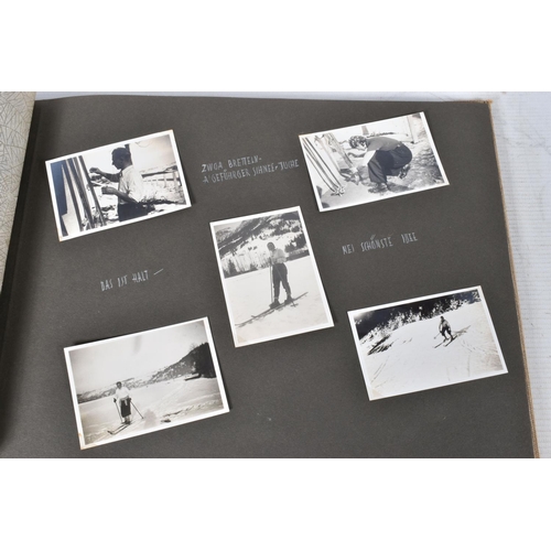 211 - TWO 1936 BERLIN OLYMPIC ALBUMS OF PHOTOGRAPHS, ticket stubs, stamped postcards, the first album cont... 